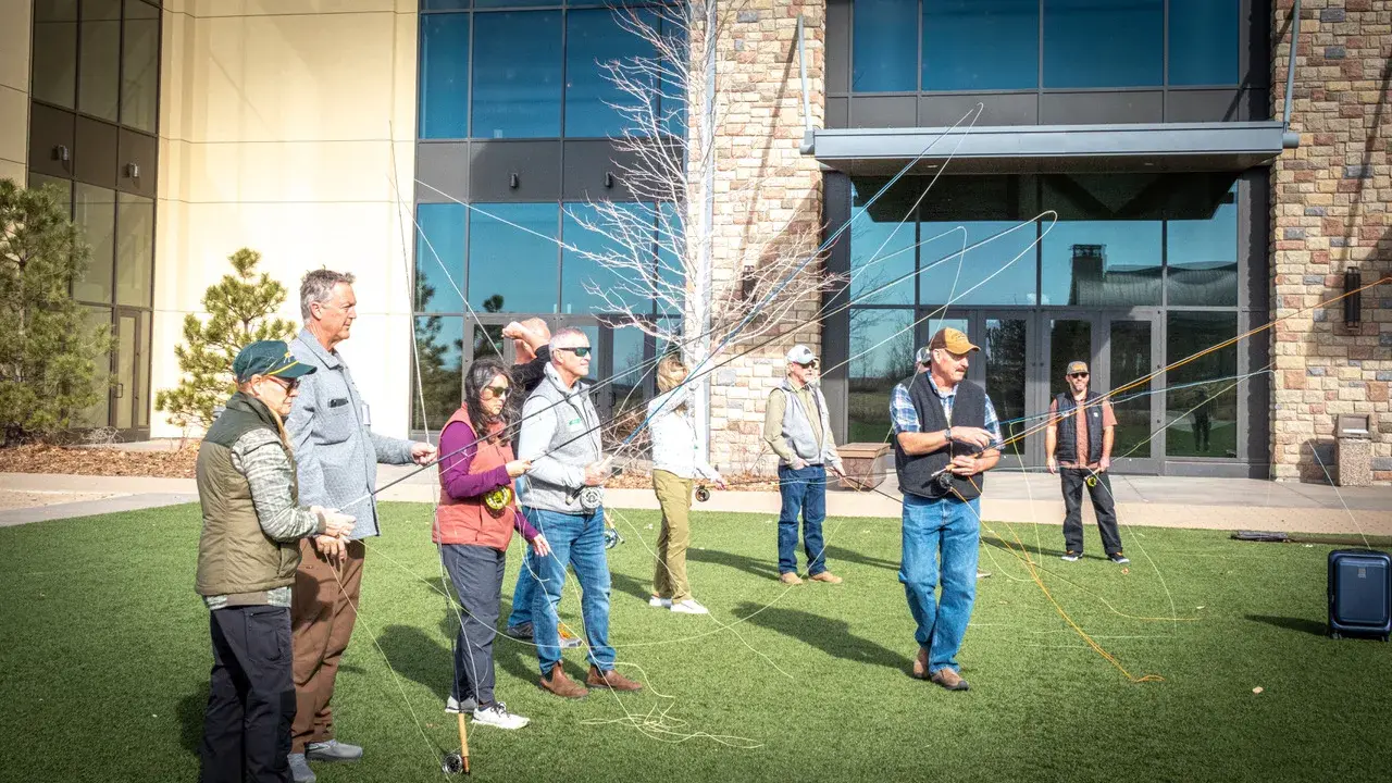 Students casting on the lawn